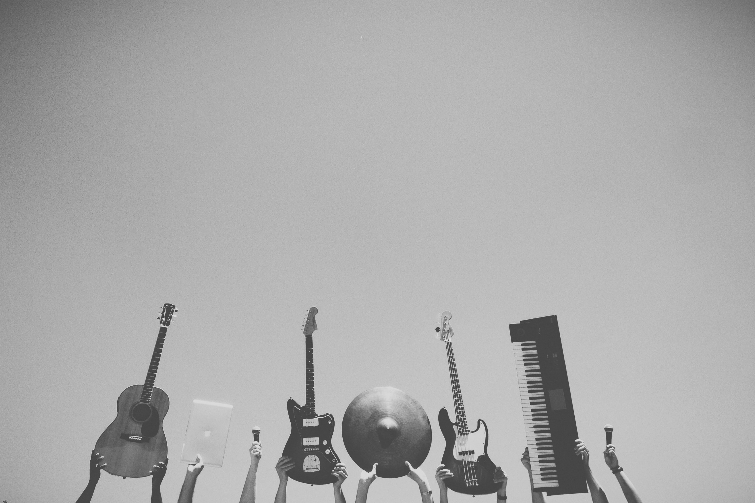 arms holding up various instruments